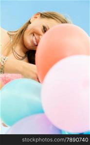 Summer holidays, celebration and lifestyle concept - Closeup beautiful woman teen girl with colorful balloons outside blue sky background