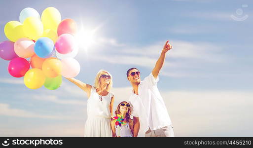 summer holidays, celebration, children and people concept - family with colorful balloons