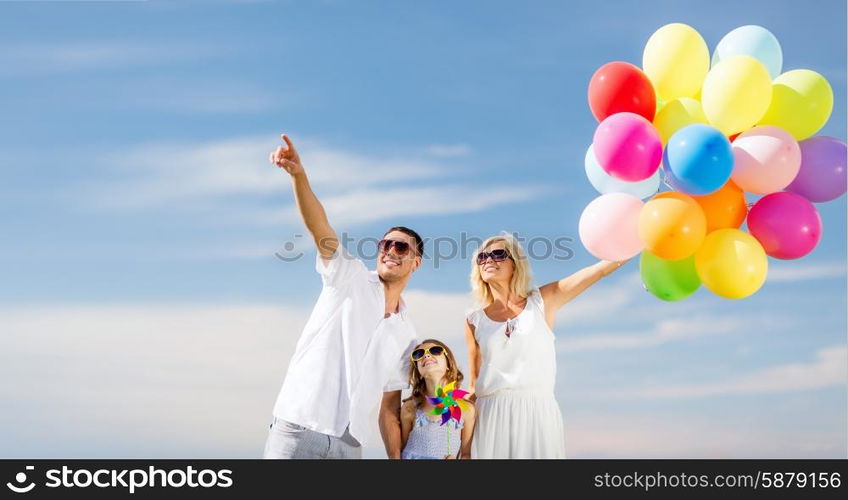 summer holidays, celebration, children and people concept - family with colorful balloons