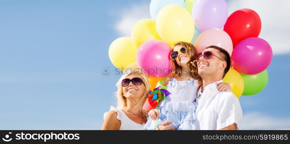 summer holidays, celebration, children and people concept - family with colorful balloons