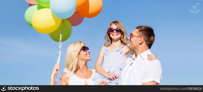 summer holidays, celebration, children and people concept - family with colorful balloons