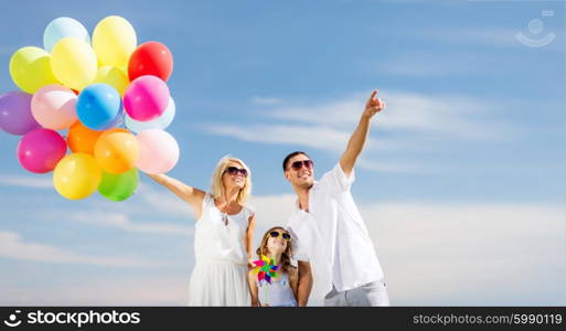 summer holidays, celebration, children and people concept - family with colorful balloons