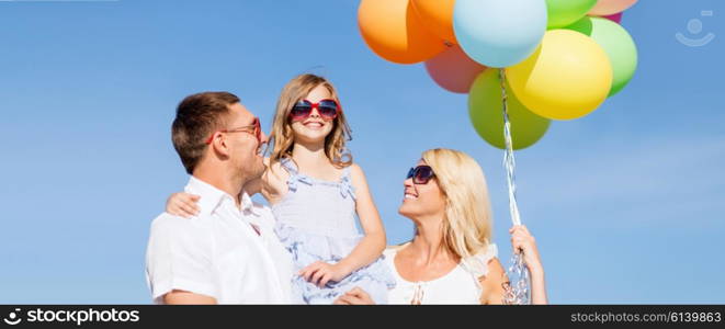 summer holidays, celebration, children and people concept - family with colorful balloons