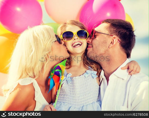 summer holidays, celebration, children and people concept - family with colorful balloons