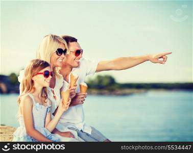 summer holidays, celebration, children and people concept - happy family eating ice cream