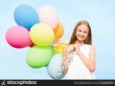 summer holidays, celebration, family, children and people concept - happy girl with colorful balloons