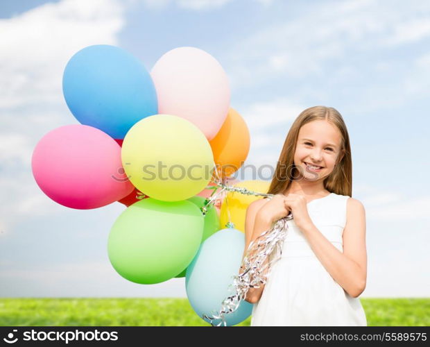 summer holidays, celebration, family, children and people concept - happy girl with colorful balloons