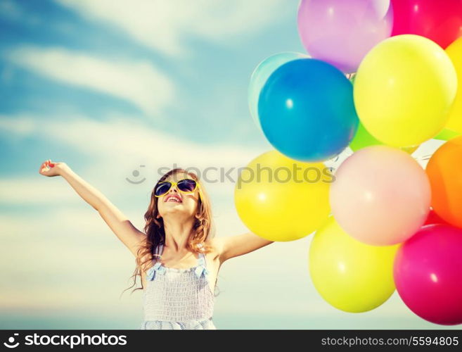 summer holidays, celebration, family, children and people concept - happy girl with colorful balloons