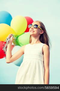 summer holidays, celebration, family, children and people concept - happy girl with colorful balloons