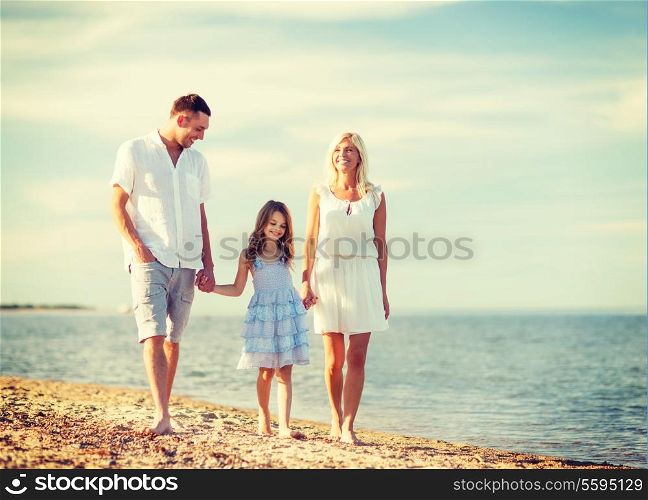 summer holidays, children and people concept - happy family at the seaside