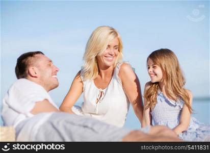 summer holidays, children and people concept - happy family having a picnic