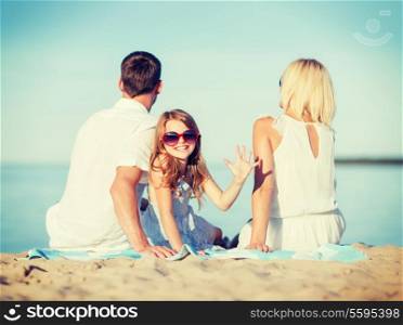 summer holidays, children and people concept - happy family on the beach
