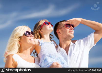 summer holidays, children and people concept - happy family with blue sky