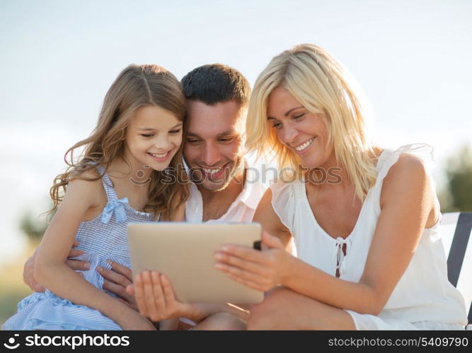 summer holidays, children and people concept - happy family with tablet pc taking picture