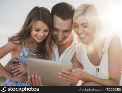 summer holidays, children and people concept - happy family with tablet pc taking picture