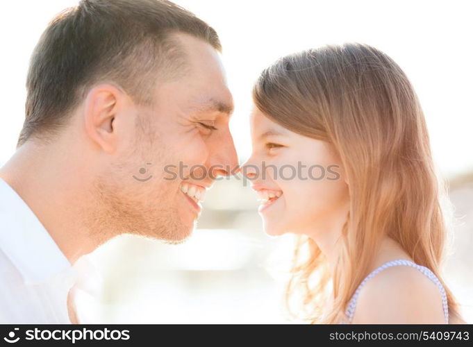 summer holidays, children and people concept - happy father and child girl having fun