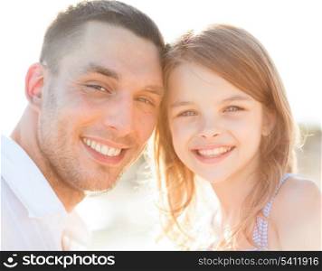 summer holidays, children and people concept - happy father and child girl having fun