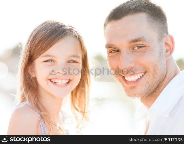 summer holidays, children and people concept - happy father and child girl having fun