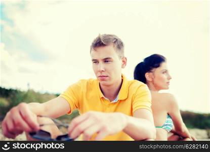 summer holidays, dating and relationships concept - stressed couple outside