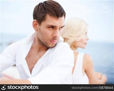 summer holidays, dating and relationships concept - stressed man with woman outside
