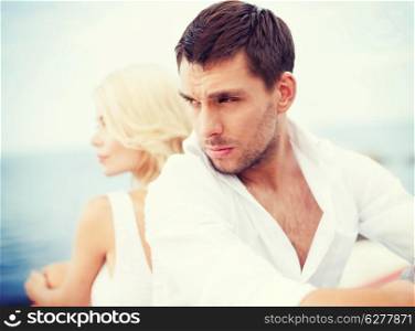 summer holidays, dating and relationships concept - stressed man with woman outside