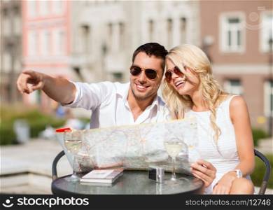 summer holidays, dating and tourism concept - couple with map in cafe in the city