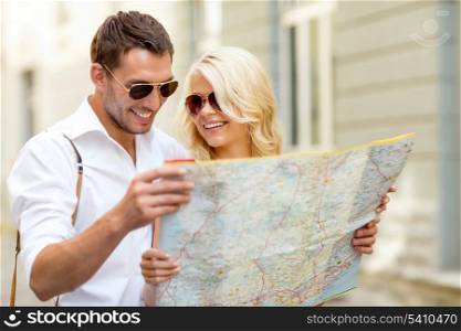 summer holidays, dating and tourism concept - smiling couple in sunglasses with map in the city