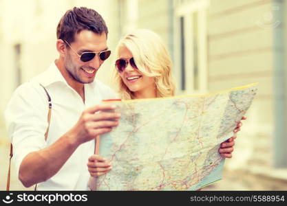 summer holidays, dating and tourism concept - smiling couple in sunglasses with map in the city