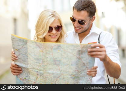 summer holidays, dating and tourism concept - smiling couple in sunglasses with map in the city