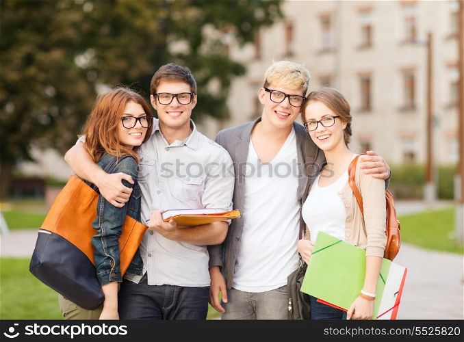 summer holidays, education, campus and teenage concept - group of students or teenagers with files, folders and eyeglasses hanging out