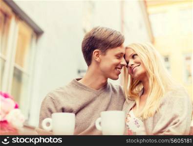 summer holidays, love, travel, relationship and dating concept - romantic happy couple in the cafe