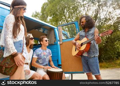 summer holidays, road trip, travel and people concept - happy young hippie friends with guitar and tom-tom drum having fun and playing music in minivan car. happy hippie friends playing music in minivan