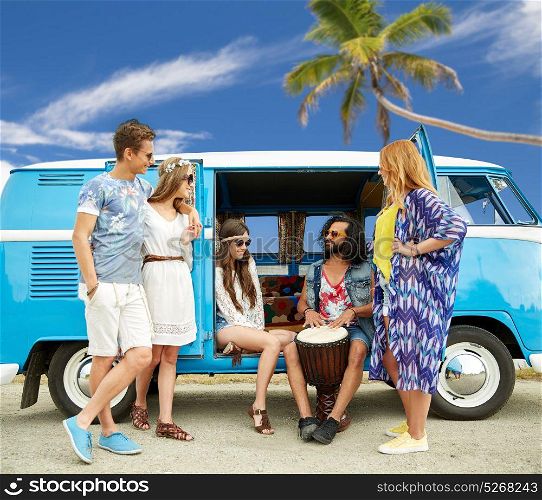 summer holidays, road trip, travel and people concept - happy young hippie friends with tom-tom drum playing music at minivan car over beach background. hippie friends with tom-tom playing music over car