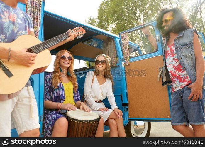 summer holidays, road trip, travel and people concept - happy young hippie friends with guitar and tom-tom drum having fun and playing music in minivan car. happy hippie friends playing music in minivan