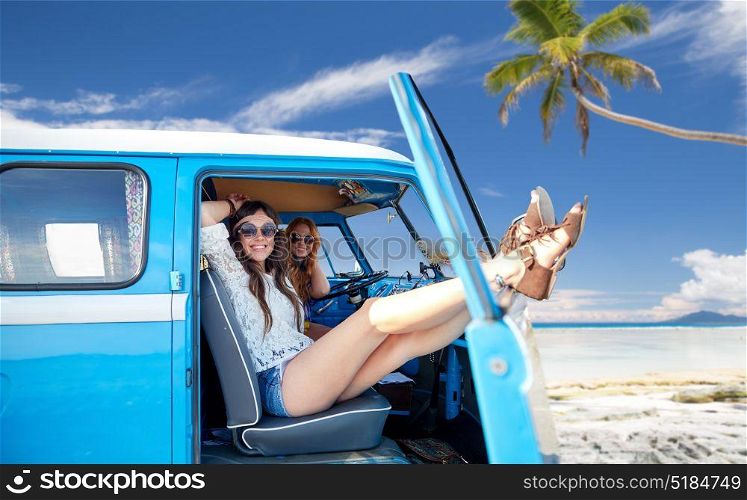 summer holidays, road trip, travel and people concept - smiling young hippie women resting in minivan car over tropical beach background. happy hippie women in minivan car on summer beach