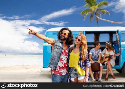 summer holidays, road trip, travel and people concept - smiling young hippie couple with friends in minivan car over beach background. happy hippie couples and minivan on beach