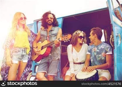 summer holidays, road trip, vacation, travel and people concept - happy young hippie friends with guitar and tom-tom drum playing music over minivan car