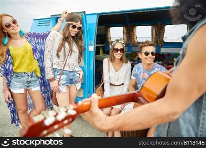 summer holidays, road trip, vacation, travel and people concept - happy young hippie friends having fun and playing music over minivan car