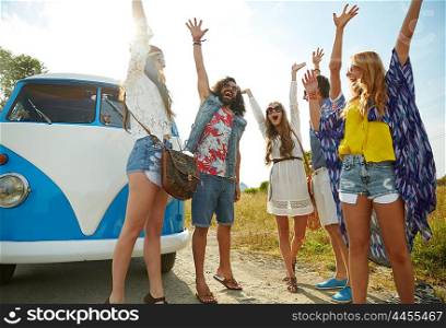 summer holidays, road trip, vacation, travel and people concept - smiling young hippie friends having fun over minivan car