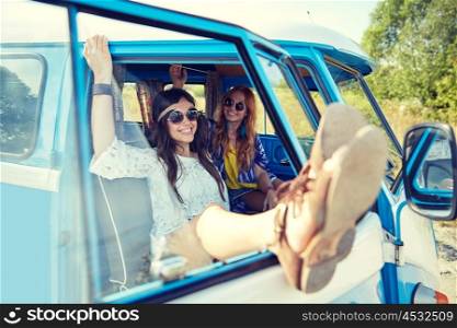 summer holidays, road trip, vacation, travel and people concept - smiling young hippie women resting in minivan car