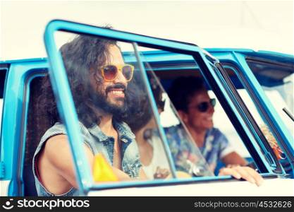 summer holidays, road trip, vacation, travel and people concept - smiling young hippie friends in minivan car