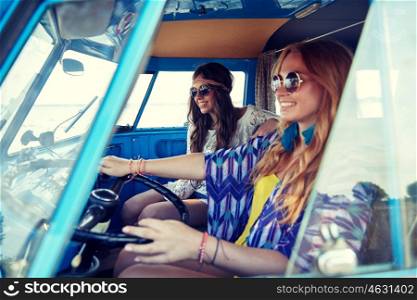 summer holidays, road trip, vacation, travel and people concept - smiling young hippie women driving in minivan car