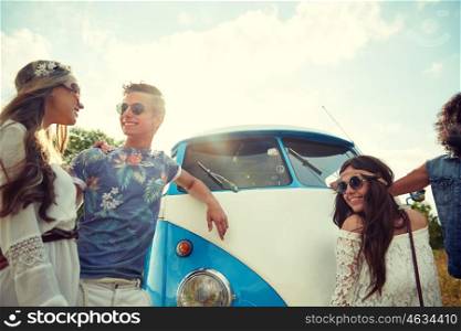 summer holidays, road trip, vacation, travel and people concept - smiling young hippie friends over minivan car