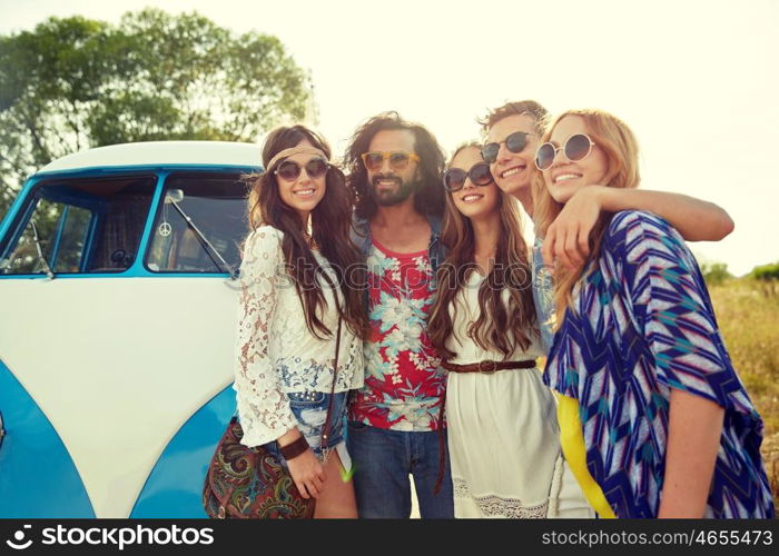 summer holidays, road trip, vacation, travel and people concept - smiling young hippie friends over minivan car