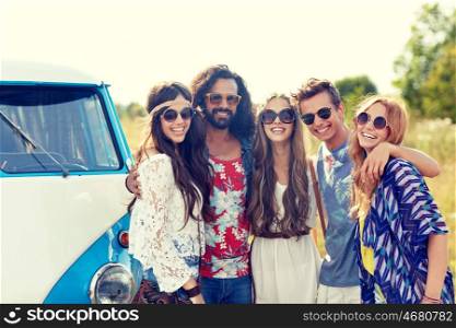 summer holidays, road trip, vacation, travel and people concept - smiling young hippie friends hugging over minivan car