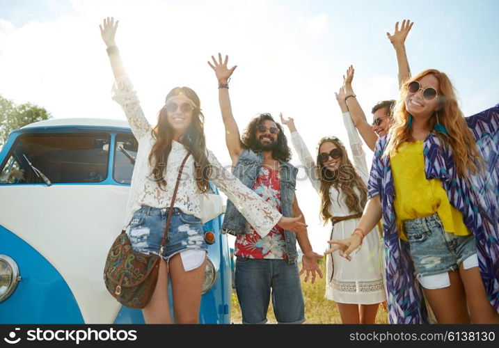 summer holidays, road trip, vacation, travel and people concept - smiling young hippie friends having fun over minivan car