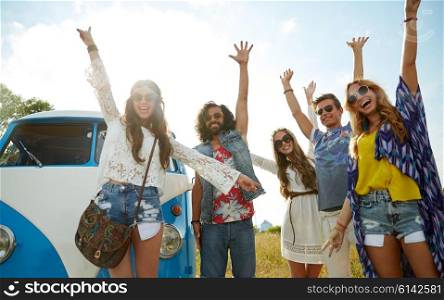 summer holidays, road trip, vacation, travel and people concept - smiling young hippie friends having fun over minivan car