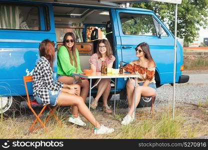 Summer holidays, road trip, vacation, travel and people concept - smiling young hippie women in car