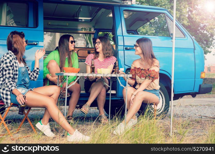 Summer holidays, road trip, vacation, travel and people concept - smiling young hippie women in car