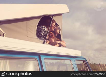 Summer holidays, road trip, vacation, travel and people concept - smiling young hippie women in car